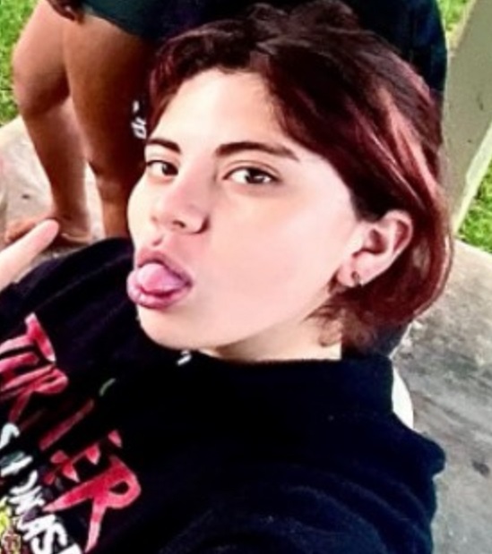 Missing Children: Karina Cruz, eyes color Brown, hair color Brown/Red, weight 142pounds, height 5feet 1inches, 